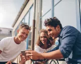 Young people on their mobiles
