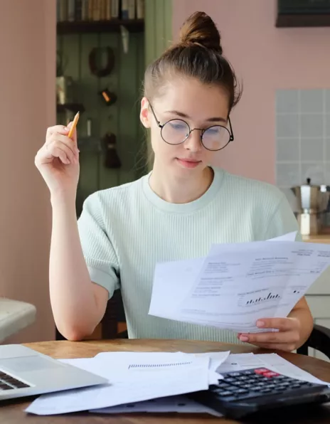 Young woman with bills